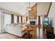 Spacious living room with a stone fireplace, vaulted ceilings, and ample natural light at 1800 Hunters Moon Dr, Alpharetta, GA 30005