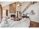 Living room showcases a stone fireplace, hardwood floors, and large comfortable seating at 1800 Hunters Moon Dr, Alpharetta, GA 30005