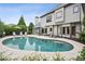 Backyard pool with a beautiful patio, mature landscaping, and inviting outdoor space at 1800 Hunters Moon Dr, Alpharetta, GA 30005