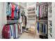 Organized walk-in closet with shelving, hanging rods, and ample storage space at 1800 Hunters Moon Dr, Alpharetta, GA 30005