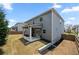 Exterior view of a well-maintained backyard with a covered patio and green lawn at 193 Treeline Trl, Canton, GA 30115