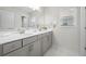 Modern bathroom featuring double vanity, large mirror, and stylish gray cabinets at 193 Treeline Trl, Canton, GA 30115