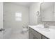 Bright bathroom featuring a tub, shower, toilet, vanity, and marble tiling at 193 Treeline Trl, Canton, GA 30115