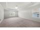 Large primary bedroom featuring carpet, a window, and tray ceilings at 193 Treeline Trl, Canton, GA 30115