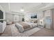 Staged primary bedroom with tray ceiling, carpet, and large windows at 193 Treeline Trl, Canton, GA 30115