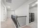 Hallway featuring the staircase, laundry room, and several doors at 193 Treeline Trl, Canton, GA 30115