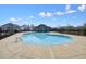 Beautiful community pool with clubhouse and ample space for relaxing at 193 Treeline Trl, Canton, GA 30115