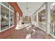 Covered back porch with railing offers stunning views of the wooded backyard at 271 Brooks Rackley Rd, Dallas, GA 30157