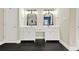 Bathroom with a double sink vanity with black framed mirrors and tiled floor at 271 Brooks Rackley Rd, Dallas, GA 30157