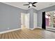 Bedroom with laminate floors, windows, neutral wall color, and ceiling fan at 271 Brooks Rackley Rd, Dallas, GA 30157