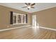 Spacious bedroom with laminate wood flooring, ceiling fan, and large windows at 271 Brooks Rackley Rd, Dallas, GA 30157