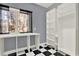 Custom closet features checkered floors, storage shelves, and natural lighting at 271 Brooks Rackley Rd, Dallas, GA 30157