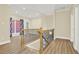 Hallway features wood floors, decorative railing, and recessed lighting at 271 Brooks Rackley Rd, Dallas, GA 30157