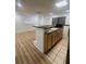 Open kitchen bar with wooden cabinets, stainless steel sink, and a brick accent wall at 271 Brooks Rackley Rd, Dallas, GA 30157