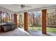 Covered patio featuring brick columns, ceiling fan, grill and wooded view, perfect for outdoor entertaining at 271 Brooks Rackley Rd, Dallas, GA 30157