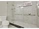 Bright shower with white subway tile surround, safety bars, and tiled flooring at 271 Brooks Rackley Rd, Dallas, GA 30157