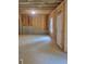 Unfinished basement with exposed beams and concrete walls and a door to the outside at 558 Fairview Oak Pl, Dallas, GA 30157
