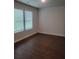 Bedroom featuring neutral walls, two large windows and vinyl plank flooring at 558 Fairview Oak Pl, Dallas, GA 30157