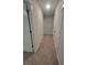 Hallway with carpet, white doors, and a view into other rooms at 558 Fairview Oak Pl, Dallas, GA 30157