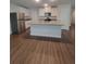 Bright kitchen features stainless steel appliances, granite countertops and a center island at 558 Fairview Oak Pl, Dallas, GA 30157