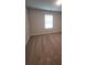 Open loft area featuring soft carpeting and a window for natural light at 558 Fairview Oak Pl, Dallas, GA 30157