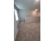 Open loft area with carpet, natural light, and ample space at 558 Fairview Oak Pl, Dallas, GA 30157