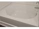White tub with white tile surround at 558 Fairview Oak Pl, Dallas, GA 30157