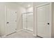 Full bathroom featuring a stand up shower between two doorways at 616 Rodeo Dr, Auburn, GA 30011