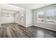 Dining room featuring stylish chandelier, luxury vinyl plank flooring, and abundant natural light at 616 Rodeo Dr, Auburn, GA 30011