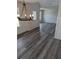 Dining room featuring stylish chandelier, luxury vinyl plank flooring, and abundant natural light at 616 Rodeo Dr, Auburn, GA 30011