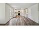 An open kitchen/living area with stainless appliances and white cabinetry at 616 Rodeo Dr, Auburn, GA 30011