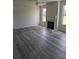 Bright living room featuring a fireplace and large windows for natural light at 616 Rodeo Dr, Auburn, GA 30011