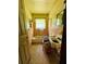 Small bathroom with tiled walls, toilet, sink, and a small window at 1934 Apache Se Trl, Atlanta, GA 30316