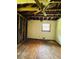 Partially renovated bedroom with hardwood floors and a window providing natural light at 1934 Apache Se Trl, Atlanta, GA 30316