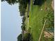 A view of the overgrown front yard and the street at 1934 Apache Se Trl, Atlanta, GA 30316