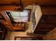 Damaged kitchen featuring old cabinets, sink area, and visible water damage; in need of renovation at 1934 Apache Se Trl, Atlanta, GA 30316
