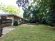 Sprawling backyard with a large deck and mature trees offering shade and privacy at 2225 Harold Se Ln, Smyrna, GA 30080