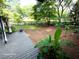 Outdoor space featuring deck, potted plants, and fenced-in backyard, perfect for outdoor living at 2225 Harold Se Ln, Smyrna, GA 30080