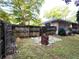 Fenced backyard features a paved patio area, perfect for outdoor relaxation and entertaining at 2225 Harold Se Ln, Smyrna, GA 30080