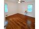 Spacious bedroom features hardwood floors and two windows at 2225 Harold Se Ln, Smyrna, GA 30080