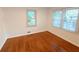 Hardwood floors in a bedroom with two windows allowing plenty of natural light at 2225 Harold Se Ln, Smyrna, GA 30080