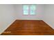Bedroom featuring hardwood floors and bright natural light from two windows at 2225 Harold Se Ln, Smyrna, GA 30080