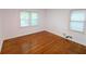 Bedroom with hardwood floors and two windows at 2225 Harold Se Ln, Smyrna, GA 30080