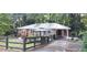 Charming brick home with a metal roof and welcoming front gazebo at 2225 Harold Se Ln, Smyrna, GA 30080