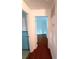 Bright hallway leads to a room with wood floors and a built-in bookshelf at 2225 Harold Se Ln, Smyrna, GA 30080