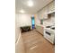 Well-lit kitchen with white cabinets, modern appliances, and stylish countertops, offering a clean and efficient cooking space at 2225 Harold Se Ln, Smyrna, GA 30080