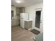 Bright kitchen featuring modern cabinetry, stainless steel appliances, and door to exterior at 2225 Harold Se Ln, Smyrna, GA 30080