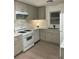 Kitchen featuring stainless steel appliances, updated countertops, and ample cabinet space at 2225 Harold Se Ln, Smyrna, GA 30080