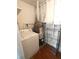 Utility room with washer, water heater, and shelving for efficient home maintenance at 2225 Harold Se Ln, Smyrna, GA 30080