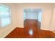 Bright living room with hardwood floors and large windows for plenty of natural light at 2225 Harold Se Ln, Smyrna, GA 30080